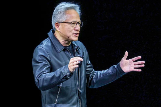 Nvidia CEO Jensen Huang on stage unveiling new AI-chip products following Nvidia market cap surge - Nvidia Hits $5 Trillion Market Cap Amid AI Chip Boom